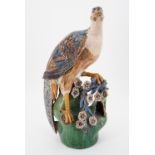An antique majollica glazed earthenware model of a bird, of Arts and Crafts influence, possibly