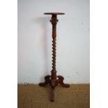 A Victorian tripod torchere, 85 cm