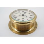 A 20th Century English marine bulkhead clock, the case back stamped CKHW9, 20.5 cm