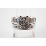 An 18ct white gold and diamond wedding ring set, comprising engagement ring and wedding band, the