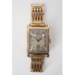 A 1920s 9ct gold wrist watch, having an un-named Swiss movement and frosted silver face with