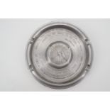 A turned aluminium ashtray bearing an engraved Polish Air Force 303 Squadron badge and the quote "