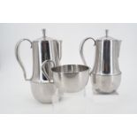 A Georg Jensen stainless steel coffee set, comprising coffee pot, hot water pot, and milk jug