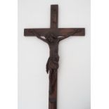 A late 19th / early 20th Century pendant or processional carved wooden crucifix, 64 cm