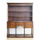 An early 19th Century oak dresser, 149 cm x 193 cm