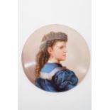 A late 19th / early 20th Century porcelain plaque depicting the profile portrait of a young lady,