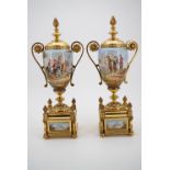 A pair of late 19th Century gilt metal mounted ceramic garniture urns, each oviform, with domed faux