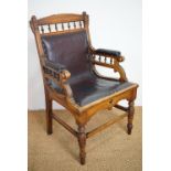 A Victorian aesthetic-influenced oak armchair