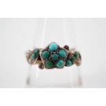 A Victorian turquoise, seed pearl and 9ct rose gold dress ring, with central flower head cluster and