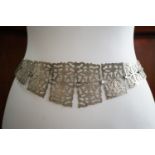 A Belle Epoque lady's silver plated belt, with graded and reticulated plaques, 70 cm