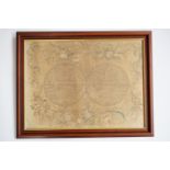 A George III silk needlework map of the world, with printed depiction of the two hemispheres side to