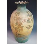 A giant 19th Century earthenware vase, of ovoid form, with everted wavy rim, hand-decorated in