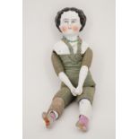 A Victorian china head and shoulder plate doll, with ceramic lower arms and legs, having a flat-