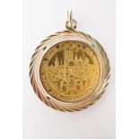 A 1972 Munich Summer Olympics fine gold football token in yellow metal pendant mount, 26 mm (in