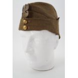A 1939 dated British Army other rank's Field Service cap with Free Polish Army buttons and cap badge