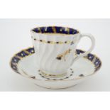 A Worcester Flight, Barr and Barr period tea cup and saucer, spirally fluted, decorated with a