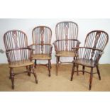 A set of four late 18th / early 19th Century yew and elm Windsor armchairs with crinoline