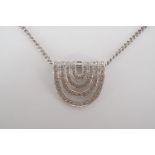 A contemporary 18ct gold and diamond pendant necklace of geometric design and Art Deco influence,