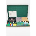 A 1960s "Six Games Universal" games compendium including roulette and bingo, 32 cm x 52 cm
