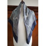 A contemporary Liberty of London silk scarf, the pattern incorporating peacock feathers, in navy