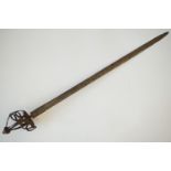 A mid-17th Century English "mortuary-hilted" broadsword, the basket hilt repousse worked and