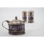 A Victorian three-piece silver cruet set, with reticulated and engraved decoration, with blue