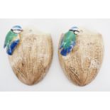 A pair of Sylvac wall pockets modelled as a blue tit perched on a coconut, pattern No 687, 20 cm