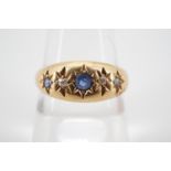 An early 20th Century sapphire and diamond ring, the brilliants gypsy set on an 18ct gold shank, 2.6