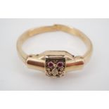 A 1930s lady's 9ct gold, diamond and ruby cocktail watch, in the form of a bangle, having a