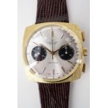 A 1960s Breitling Top Time wrist watch, having "panda" face and gold-plated case, (running)