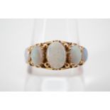 An antique five-stone 9ct gold opal cabochon ring, claw and pellet-set in a graded arrangement,