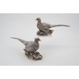 A contemporary pair of Comyns filled silver table pheasants, in the form of a hen and a cock,