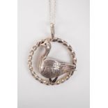 A contemporary Scottish silver pendant in the form of a goose within a cabled annulus, on a fine