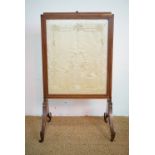 An early 19th Century height-adjustable mahogany fire screen with extending sides