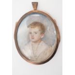An early 20th Century portrait miniature on ivory of a young boy wearing a sailor suit, unsigned, in