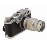 Cámara fotográfica alemana Leica modelo IIIa D.R.P. Nº 310319 con objetivo Elmar f=9 mm. 1:4, c.