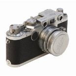 Cámara fotográfica alemana Leica modelo IIf D.R.P. Nº 5744525 con objetivo Leica f=5 cm. 1:2, c.