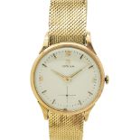 Reloj Omega de pulsera para caballero, c.1960. En oro. Esfera en tonalidad marfil con decoración