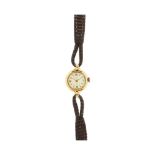 Reloj Infinit de pulsera para señora, c.1950. En oro y correa de piel. Esfera blanca con