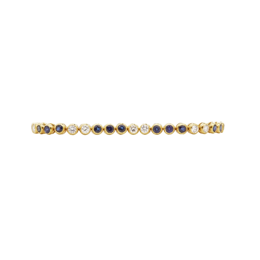 Pulsera rivière en oro con pareja de diamantes talla brillante y zafiros azules talla redonda