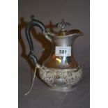Small late Victorian silver hot water pot of oval baluster form with a hinged lid and embossed