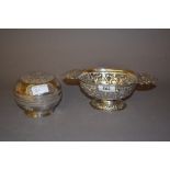 Continental white metal oval two handled pedestal bowl with embossed decoration,
