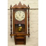 Walnut cased Vienna style wall clock having circular painted dial with Roman numerals and two train