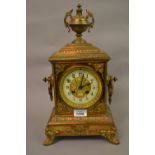 Late 19th Century gilt brass mantel clock of ornate design,