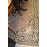 Indo Persian silk style carpet with a medallion and all-over floral design on a rose ground with