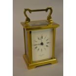 Small modern brass cased carriage clock with enamel dial, signed Bornand Freres,