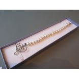 Modern uniform cultured pearl bracelet with silver clasp