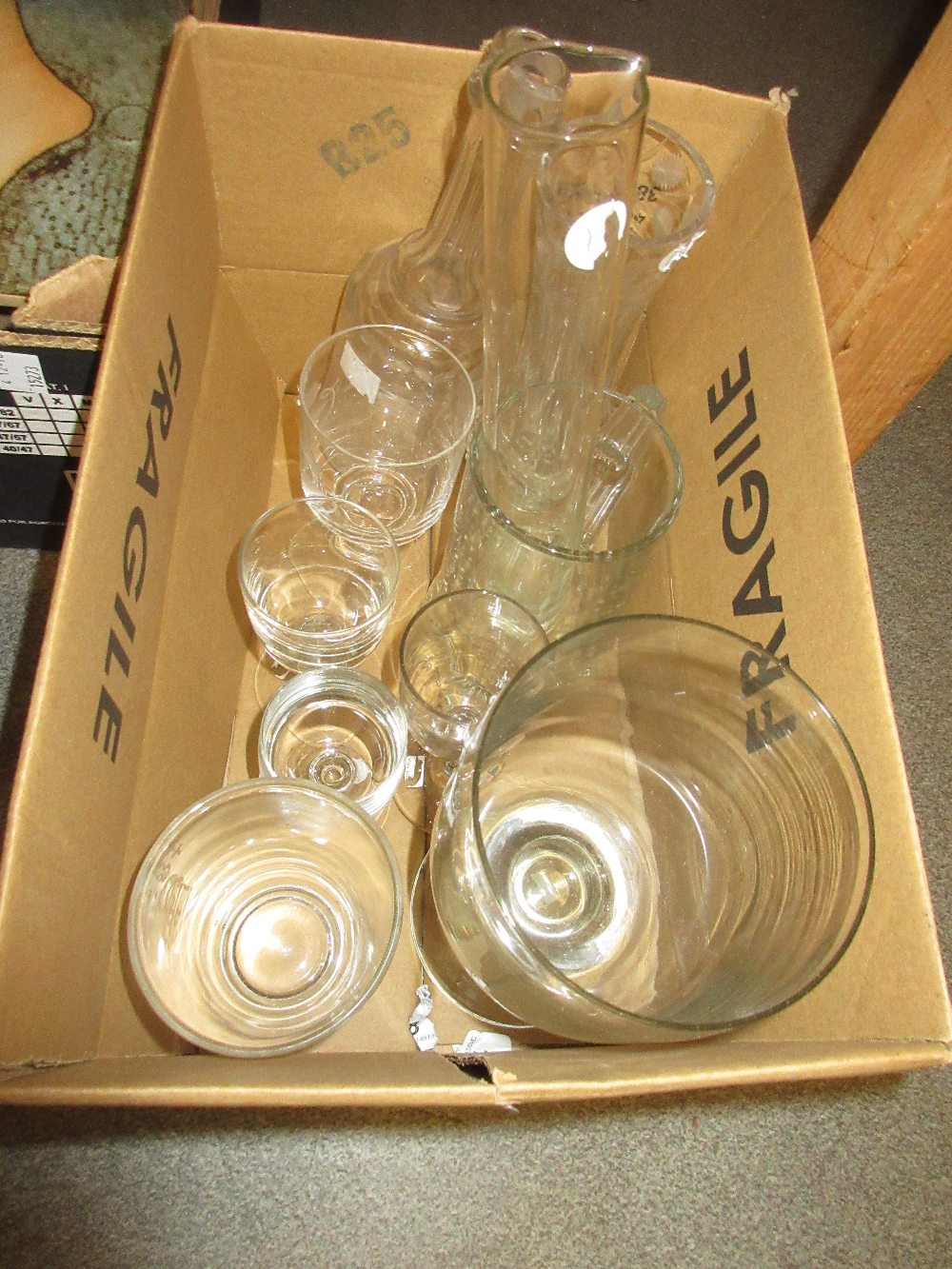 Large plain glass pedestal goblet, an antique facet cut decanter together with various mugs,