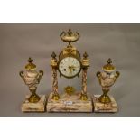 French flecked marble and ormolu clock garniture, the enamel dial with Arabic numerals,