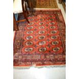 Machine woven Persian pattern rug on wine ground,